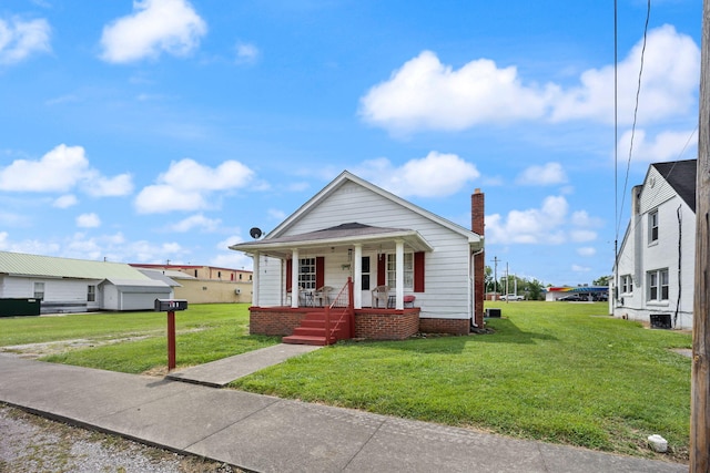 106 18th St, Corbin, KY 40701 - bungalow-style home with covered porch and a front yard