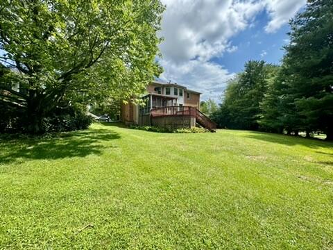 view of yard with a wooden deck