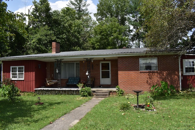 ranch-style home with a front lawn