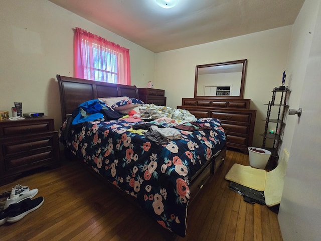 bedroom with wood-type flooring