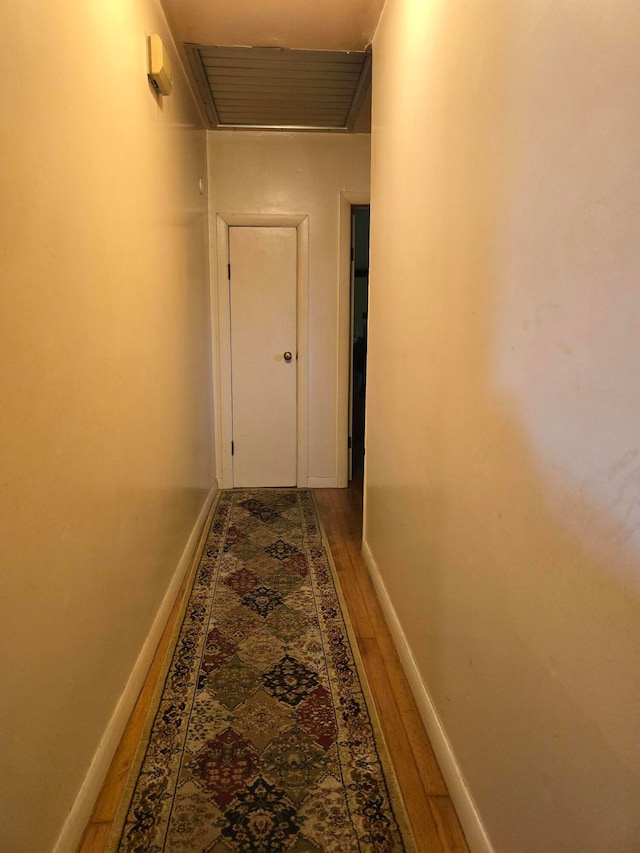 hallway featuring hardwood / wood-style flooring