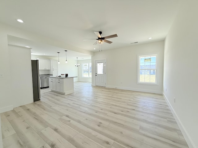 unfurnished living room with light wood finished floors, visible vents, baseboards, ceiling fan, and recessed lighting