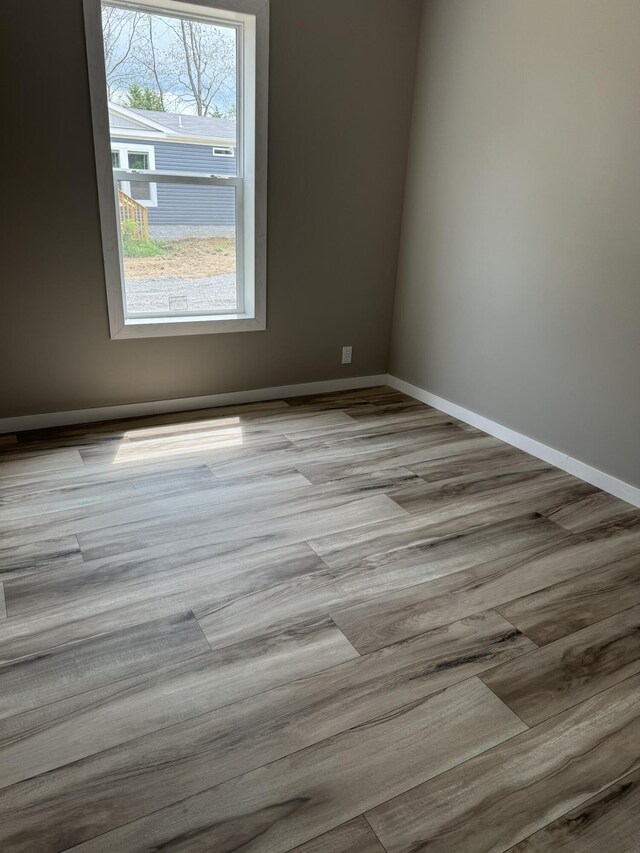 full bathroom with wood-type flooring, shower / bath combination, toilet, and vanity