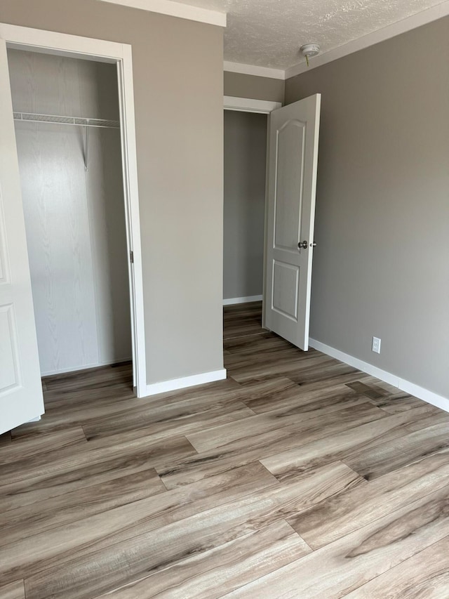 full bathroom with wood-type flooring, bathing tub / shower combination, toilet, and vanity