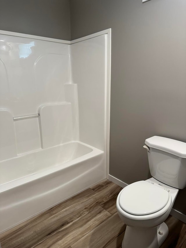 unfurnished bedroom featuring a closet, hardwood / wood-style floors, and a textured ceiling