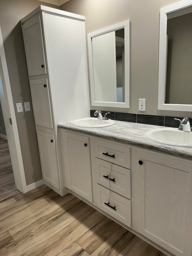 bathroom featuring a shower with shower door, hardwood / wood-style floors, and toilet