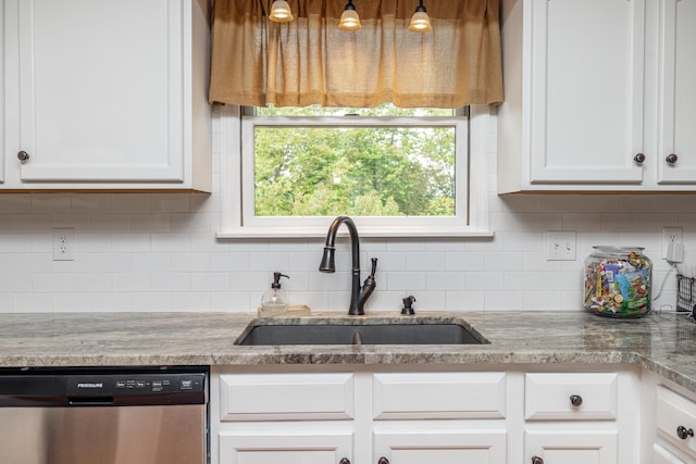 kitchen with tasteful backsplash, white cabinetry, dishwasher, and a sink