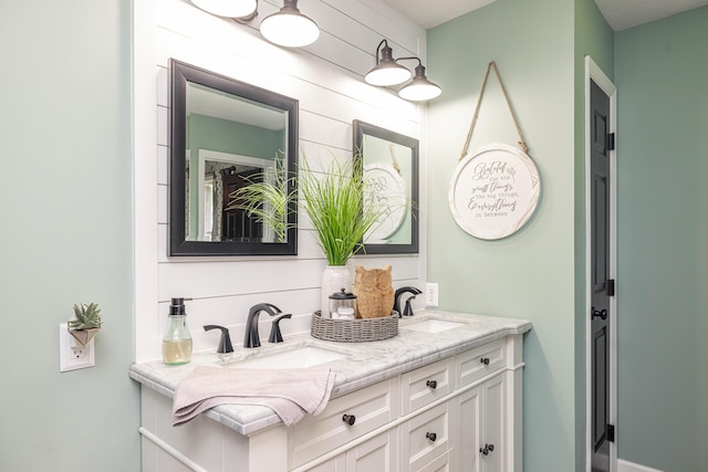 bathroom featuring double vanity and a sink