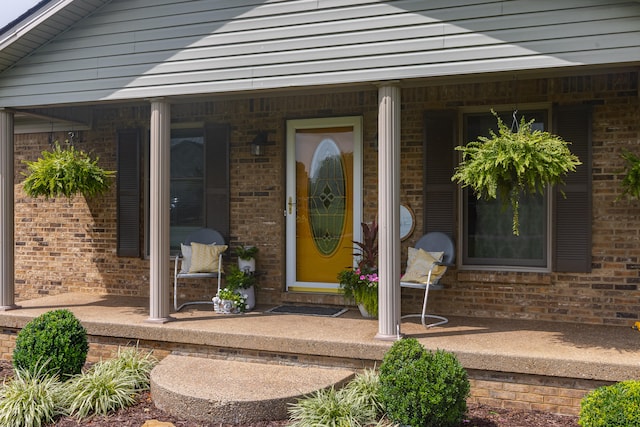 property entrance with covered porch