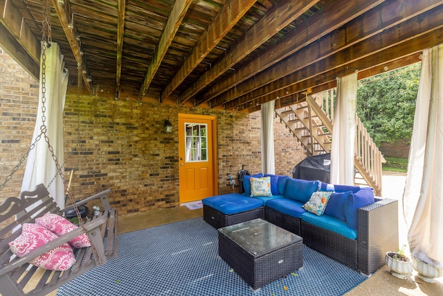 view of patio / terrace with stairs and an outdoor living space