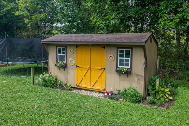 view of shed with a trampoline