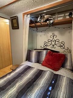 unfurnished bedroom with a textured ceiling