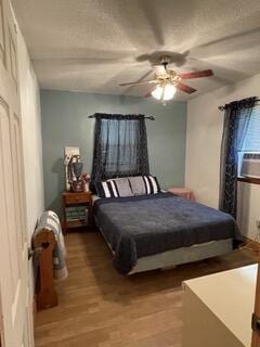 bedroom featuring a ceiling fan and light wood-style flooring