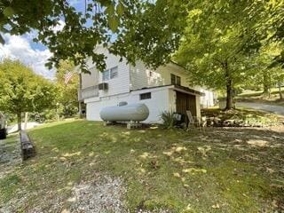 view of home's exterior with a yard