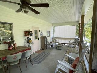 sunroom / solarium with ceiling fan