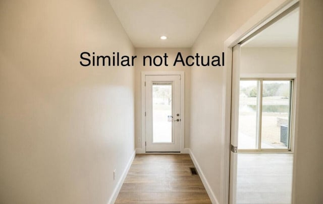 entryway with hardwood / wood-style flooring