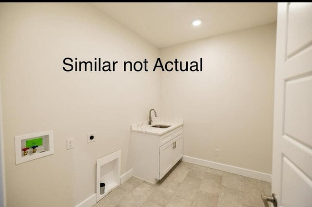 clothes washing area featuring cabinets, electric dryer hookup, hookup for a washing machine, and sink