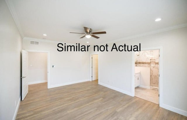 spare room with light wood-type flooring, ornamental molding, and ceiling fan