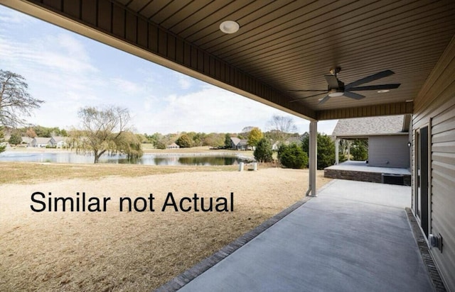 view of patio / terrace with a water view and ceiling fan