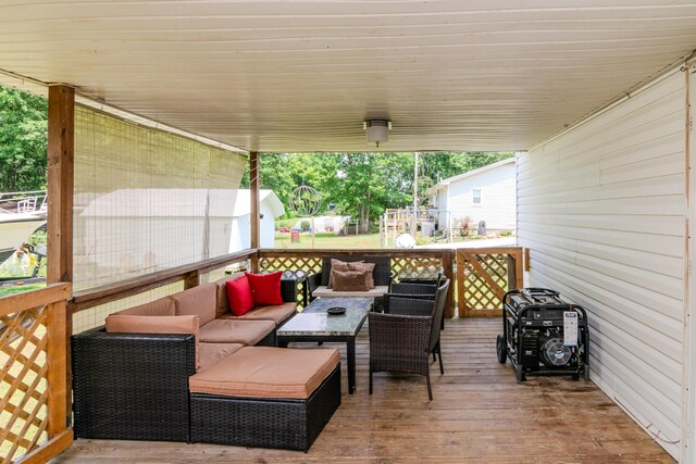 wooden deck featuring an outdoor hangout area