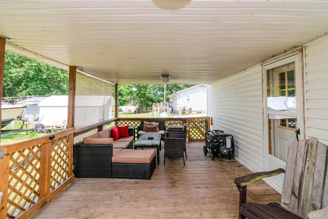 wooden terrace featuring outdoor lounge area