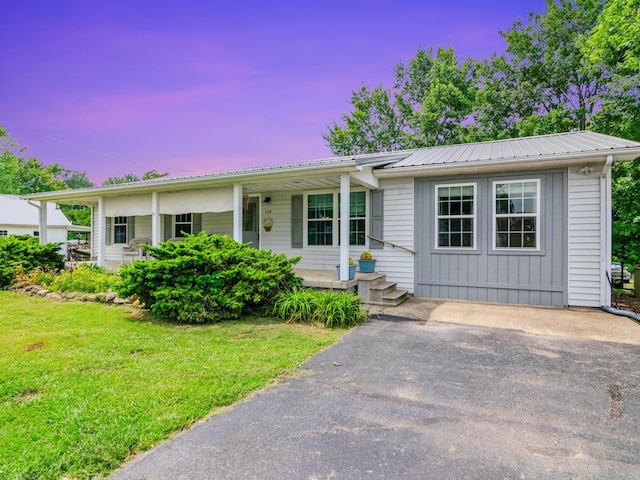 ranch-style house with a yard