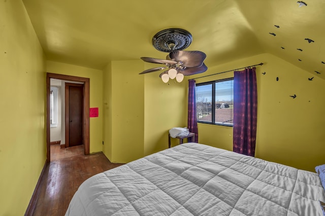 bedroom with hardwood / wood-style flooring and vaulted ceiling