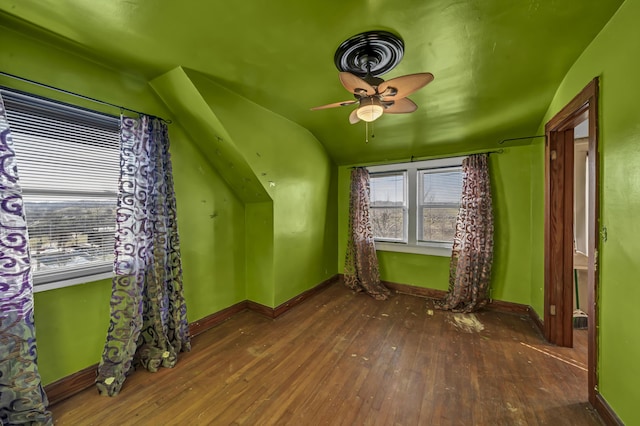 bonus room featuring vaulted ceiling, dark hardwood / wood-style floors, and ceiling fan