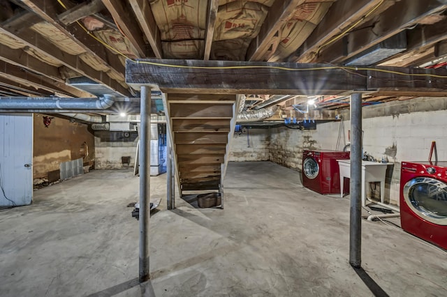 basement with separate washer and dryer and sink