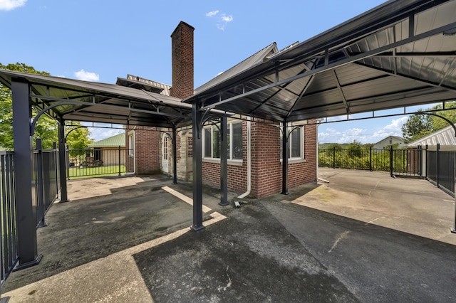 view of vehicle parking featuring a gazebo