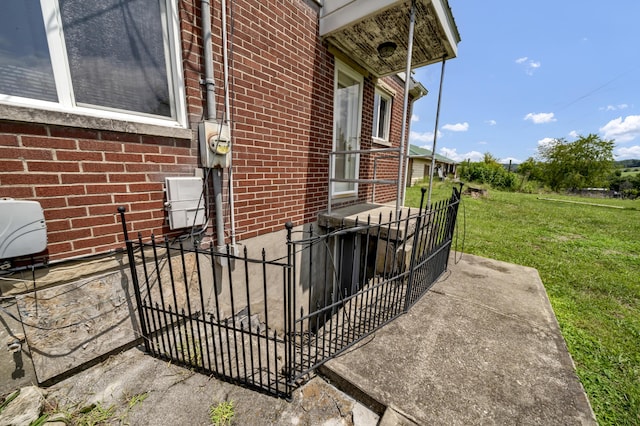 view of side of home featuring a yard