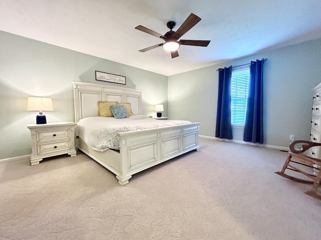 bedroom featuring light carpet and ceiling fan