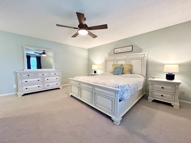 bedroom featuring light colored carpet and ceiling fan