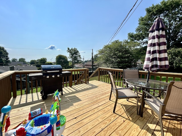 wooden terrace with area for grilling