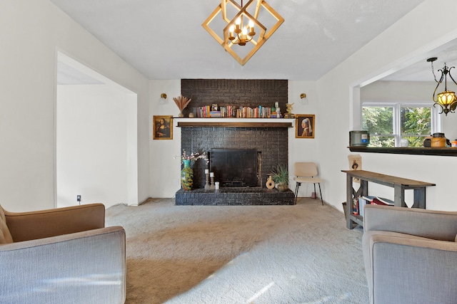 carpeted living room with a brick fireplace, a textured ceiling, and a chandelier