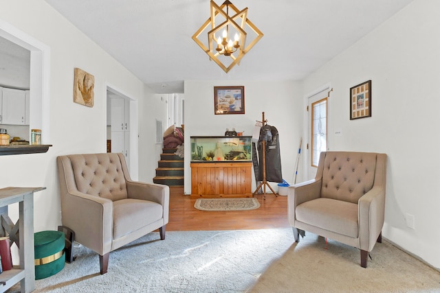 sitting room with an inviting chandelier and wood-type flooring