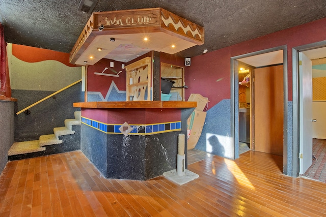 bar featuring wood-type flooring