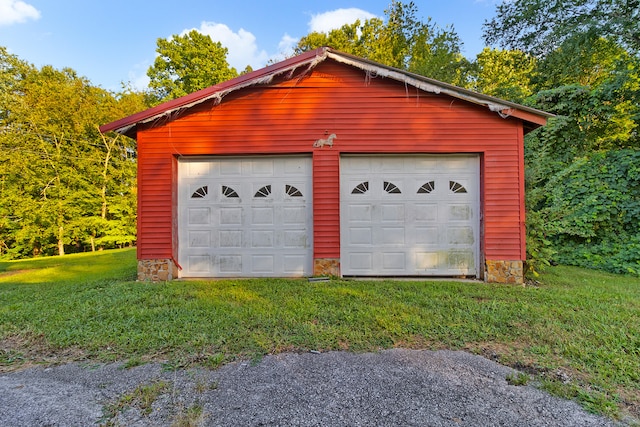 garage with a lawn