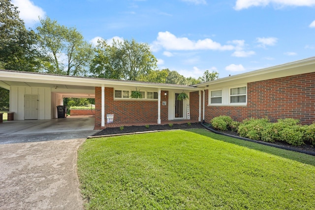 ranch-style home with a front lawn and a carport