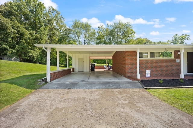 view of vehicle parking with a carport and a lawn