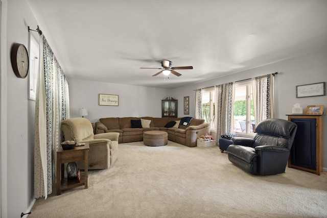 living room with carpet floors and ceiling fan