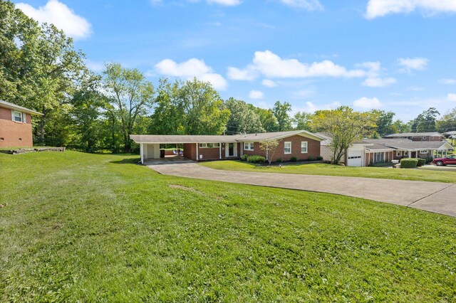 ranch-style house with a carport and a front yard