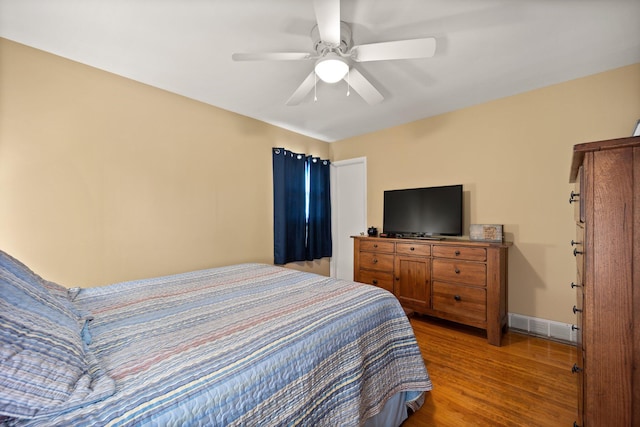 bedroom featuring hardwood / wood-style flooring and ceiling fan