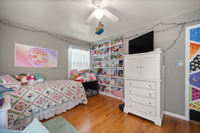 bedroom with ceiling fan and wood-type flooring