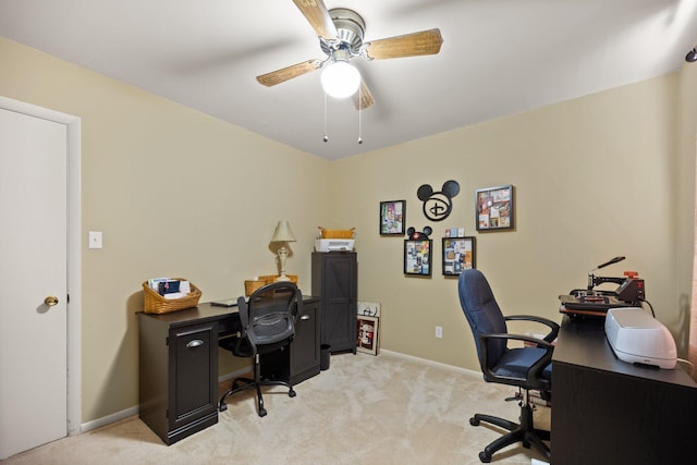 office space with ceiling fan and light colored carpet