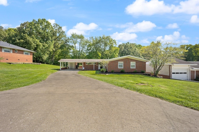 ranch-style home featuring a carport and a front yard