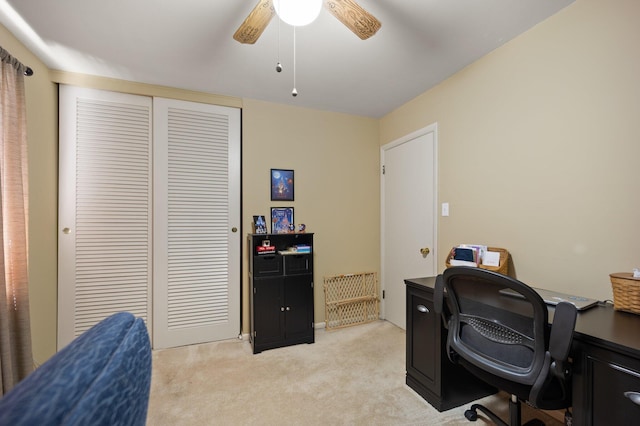 office space with ceiling fan and light colored carpet