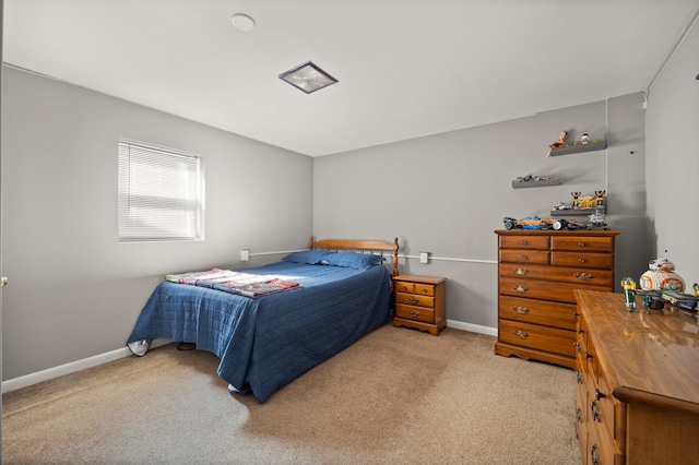 bedroom featuring light colored carpet