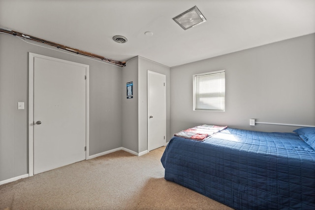 bedroom featuring light colored carpet