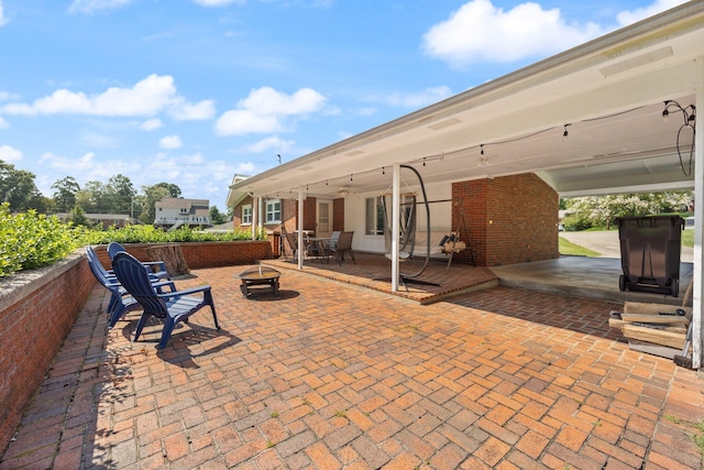 view of patio with an outdoor fire pit